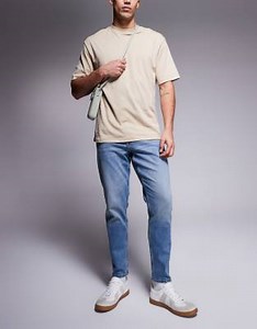 ASOS DSIGN stretch tapered jeans in mid wash with vintage tint | ASOS