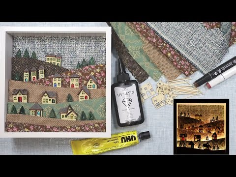 Miniature light up village scene. Deep box frame, mixed media.