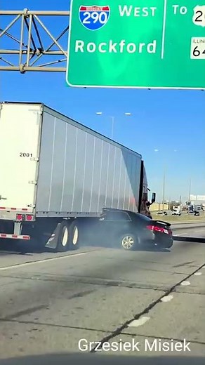 Video Shows Semi-Truck Dragging Car Down Illinois Highway