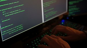 PHP-code review on screen by web developer and php developer shows computer screen with source code of website and server scripts for modern applications in secure object oriented programming language