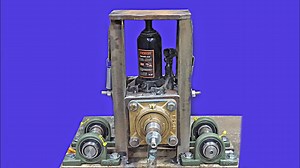 The master has invented a new bending machine with a jack