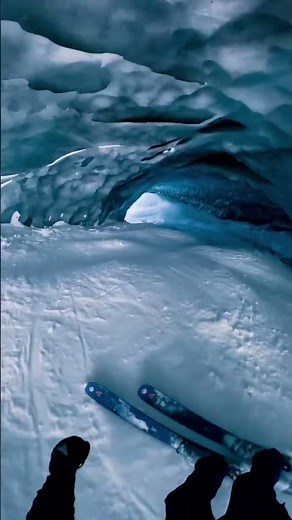 Extreme ski descent into glacier cave in Zermatt, Switzerland