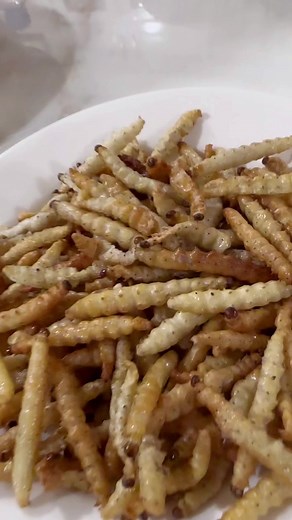 3.3K views · 41 reactions | Have you ever tried silk worm before? It's quite good if you can get over the way it looks and moves. It has a nutty creamy taste to it and pairs nicely with rice. Or you can eat it like popcorn. 藍 #silkworm #trynewfoods #delicacy #laofood #laos #livingoutlaod | Living Out LAOD | Facebook