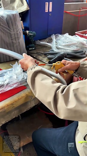 Worker Performing Soft - Sleeve Assembly Work