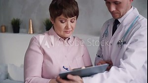 Doctor sign blank form with his patient at home