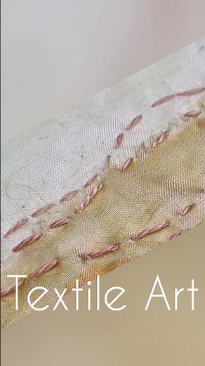 Make a simple landscape in textile art using scraps and very easy hand sewn stitches.