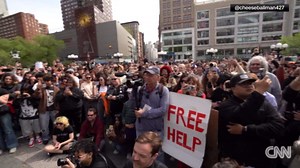 Man's cheeseball-eating prowess draws raucous crowd in New York City