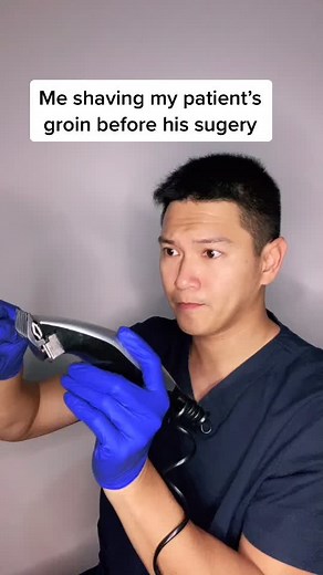 Male Nurse Shaving Patient's Groin for Surgery