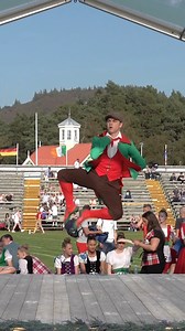 A male competitors taking part in the Irish Jig dance heats, held during the 2024 Braemar Gathering and Highland Games in Scotland. Some great side kicks from this dancer as he jumps and clicks his heels together, plus only males carry a Shillelagh to strike the ground during this dance. The Irish Jig is one of the Scottish National Dances for competitions and intended as a parody of the infamous Irish temper; an energetic dance featuring lots of fist shaking and skirt flouncing among female com