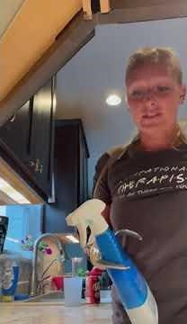 Cleaning counters with two body-powered prosthetic hooks