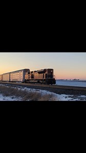 KCS DPU shoves an autorack into the sunset, February 2025. | Midwest Railroads