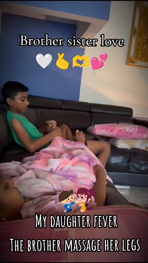 Sibling Bonding: Brother Massages Sister's Legs with Love