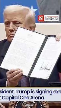 Trump Signs Executive Orders In Front Of Supporters At Capital One Arena