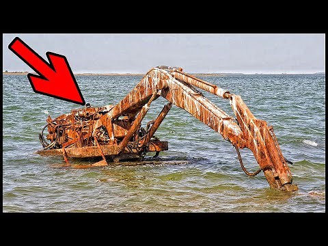 Forgotten construction machinery. Abandoned old rusty excavator