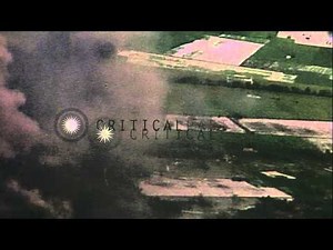 USAF A-1H Skyraider in flight over Viet Cong controlled village in South Vietnam ...HD Stock Footage
