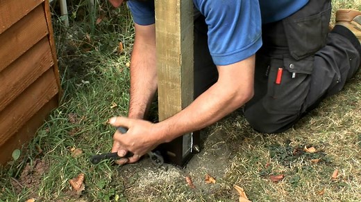 installing fence posts using metal post holders or Metposts
