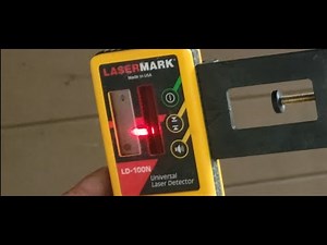 Using a laser to set our above ground pool base