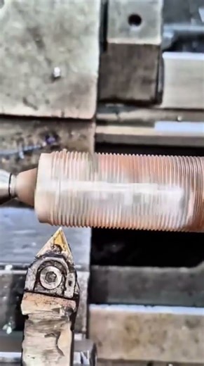 repairing damaged spark plug threads using a lathe