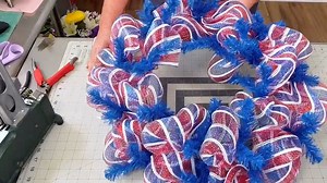 4.1K views · 29 reactions | If you’re new to deco mesh, today’s design is for you! Learn how to create this festive 4th of July wreath, complete with stars, stripes, and a classic American color palette. For this design, Coach Laurie Anne will use the “pouf method,” which is the easiest way to incorporate deco mesh (in our humble opinion). Who's going to give this a try?! | Southern Charm Wreaths | Facebook