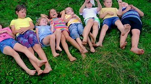 Children Feet on the Grass