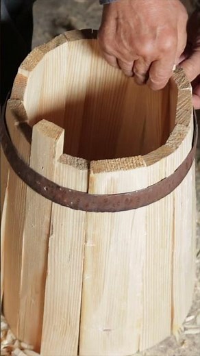 Traditional Cooper Constructing the Barrels