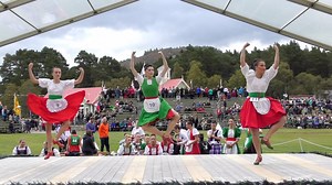 Competitors in the 'Irish Jig' Scottish Highland Dance heats during the 2018 Braemar Gathering Highland Games in Deeside, Aberdeenshire, Scotland. We think the dancer in the centre (10) is champion highland dancer Michelle Gordon from Huntly. The Scottish version is a parody of an Irish washerwoman in an agitated frame of mind, an energetic dance featuring lots of fist shaking and skirt flouncing among female competitors. It is a parody of Irish dancing and the infamous Irish temper. It is one o