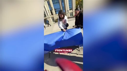 Student flips Turning Point USA table at the University of Iowa