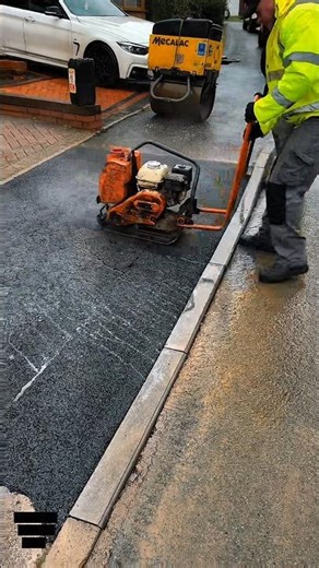 “Powerful Plate Compactor in Action – Satisfying Asphalt Compaction for Perfect Road Finish!”