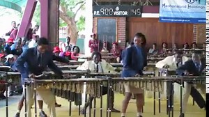 3.3K views · 104 reactions | This is awesome:The marimba is a percussion instrument consisting of a set of wooden bars struck with mallets to produce musical tones. Resonators attached to the bars amplify their sound. A player of the Marimba can be called a Marimbist or a Marimba Player. | Our Africa Now | Facebook