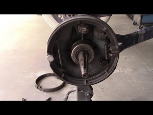 Installing lined Model T brake shoes.