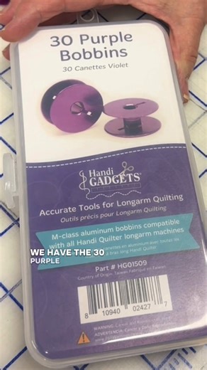 Sandy uses her purple bobbins to organize her Superior Threads Bottom Line thread! | Handi Quilter