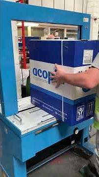 How does a strapping machine work?