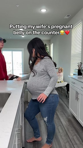 Expecting Joy: Couple's Fun with a Pregnant Belly