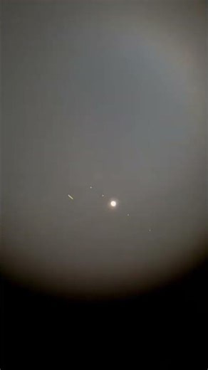 Satellite through a Telescope