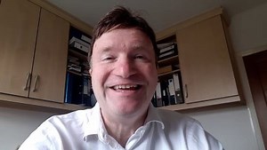 Ocado reveals interim losses nearly halved and raises outlook for robotic warehouse arm