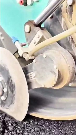 The Process of Compacting Road Asphalt Using Heavy Roller Equipment to Produce Smooth Even Results