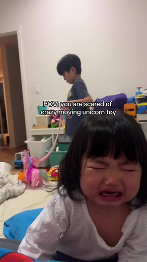 Hazel Crying While Joon Plays with a Unicorn Toy