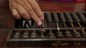 chinese abacus is a calculating tool used primarily in parts of Asia for performing arithmetic processes. The abacus was in use centuries before the adoption of the written modern numeral system. Stock Video
