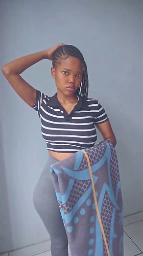 Young Woman Poses in Tight Clothing with Blanket