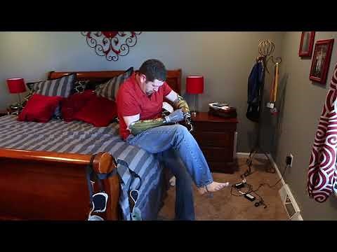 Bilateral Arm Amputee Putting On Their Prostheses Without Help