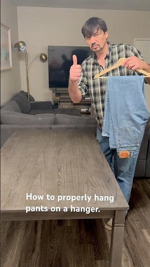 How to properly hang pants on a hanger.