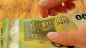 Euro bills. hands count euro bills. Expenditures and earnings of women in Europe.Money accumulations and savings. 4k footage