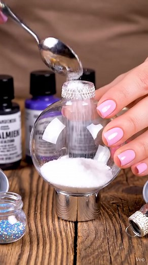 Baking Soda Galaxy Ornaments The kind of rainy day fun that’s better than cartoons. Ingredients: - Clear plastic or glass ornaments - Baking soda - Acrylic paint (black, blue, purple, pink, and gold) - Fine glitter (silver, holographic, or iridescent) - Optional: clear glue or Mod Podge - Cotton swabs or small paintbrushes These delightful galaxy ornaments are a charming way to bring a bit of the universe into your home. Start by removing the tops from your clean, dry ornaments. Add a couple tea