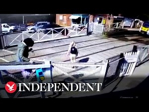 Pedestrians in near miss with train at level crossing after jumping locked barriers