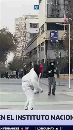 White overall-clad protesters throw Molotov cocktail at Bío Bío journalist