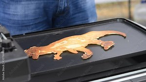 Baking pancakes. 3D printer for liquid dough. 3D printer printing pancakes with liquid dough shapes close-up. Modern additive technologies 4.0 industrial revolution. Progressive food technology