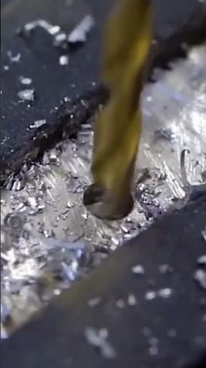 Here's how to drill a hole in a split bolt using a drill and a special drill bit.
