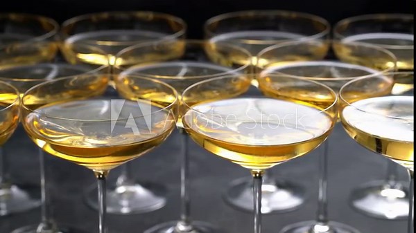 champagne wine in a coupe glasses ready to drink, close up. Close up background with glasses of sparkling champagne .
