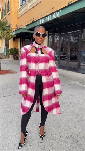 Sacha Stewart on Instagram: "Crafted from a luxuriously fuzzy mohair blend, the jacket features an oversized plaid pattern in rich magenta pink and creamy white, giving it a modern yet timeless feel. The tailored silhouette is subtly shaped at the waist for a flattering fit, while the longline length and dramatic back vent create movement and elegance from every angle. Design details elevate the look: High neckline with cut-out detail for a fashion-forward edge Structured shoulders that command