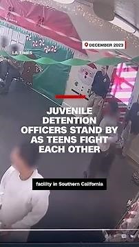 Juvenile detention officers stand by as teens fight each other